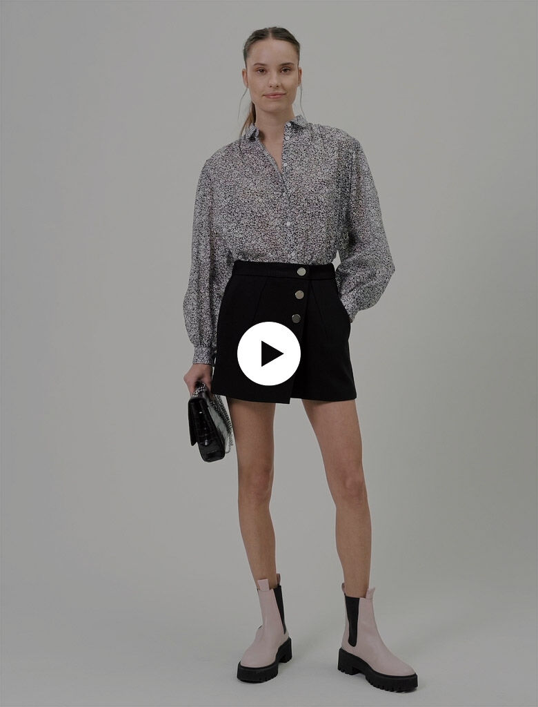 121IMAGE Trompe l’oeil shorts, mirrored buttons : Skirts & Shorts color Black